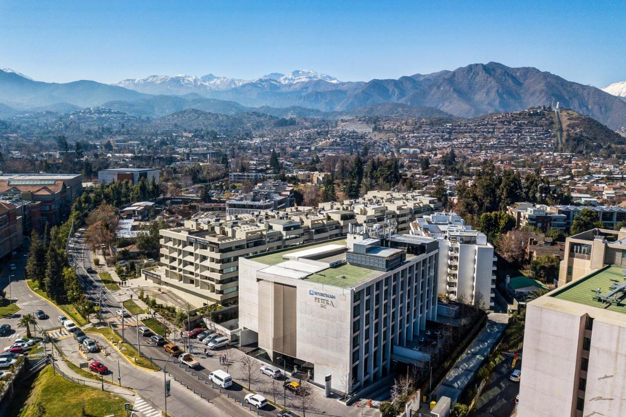 Wyndham Santiago Pettra Hotel Exterior photo The San Gabriel Mountains are visible from the campus.