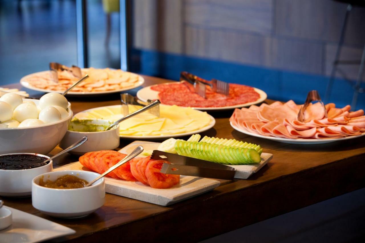 Wyndham Santiago Pettra Hotel Exterior photo A buffet of cold cuts